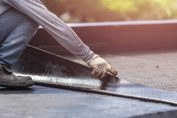 Professional Exterior Waterproofing technician working in Brunswick, GA